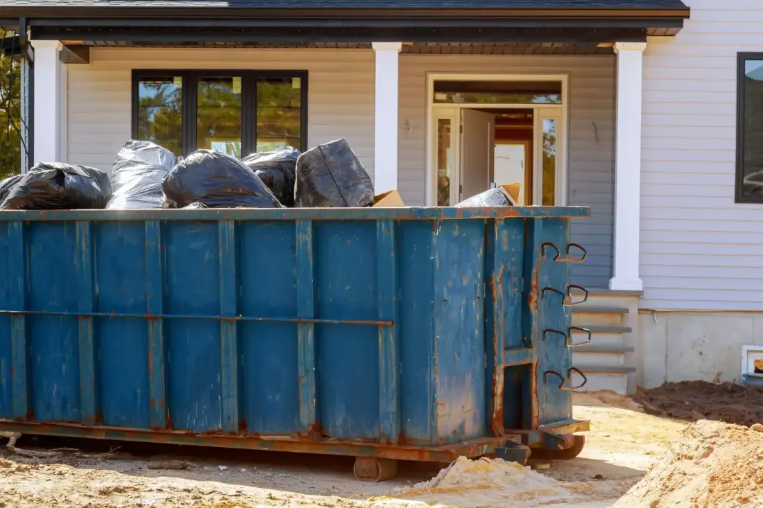 Blue roll-off dumpster ready for delivery